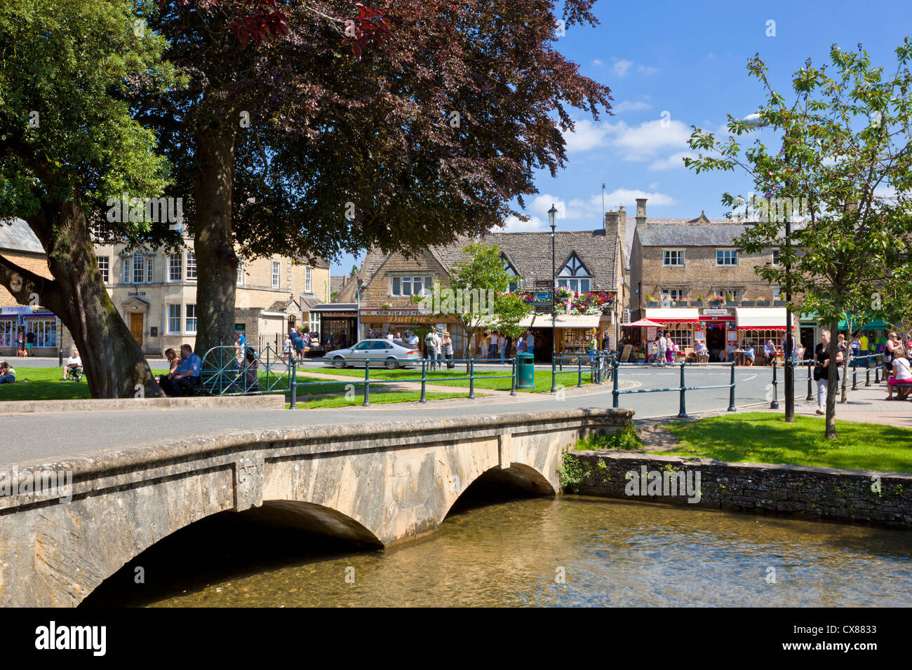 Cotswolds village of Bourton on the water with Bridge over the River Windrush in Bourton on the Water Cotswolds Gloucestershire England UK GB Europe Stock Photo