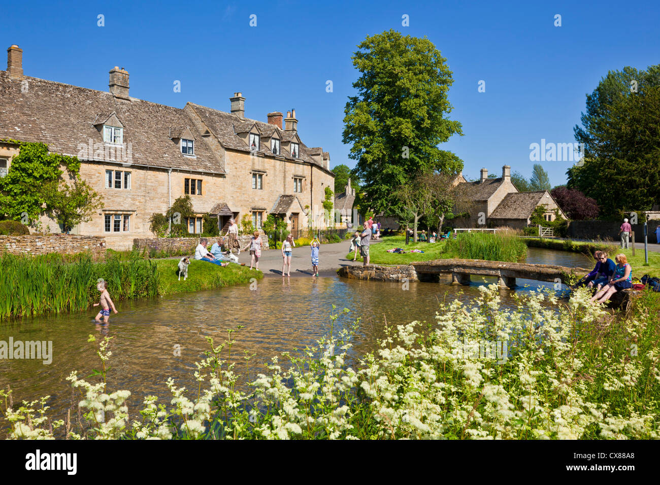 Cotswolds village of Lower Slaughter with the River Eye meandering through the village the cotswolds Gloucestershire England UK GB Europe Stock Photo