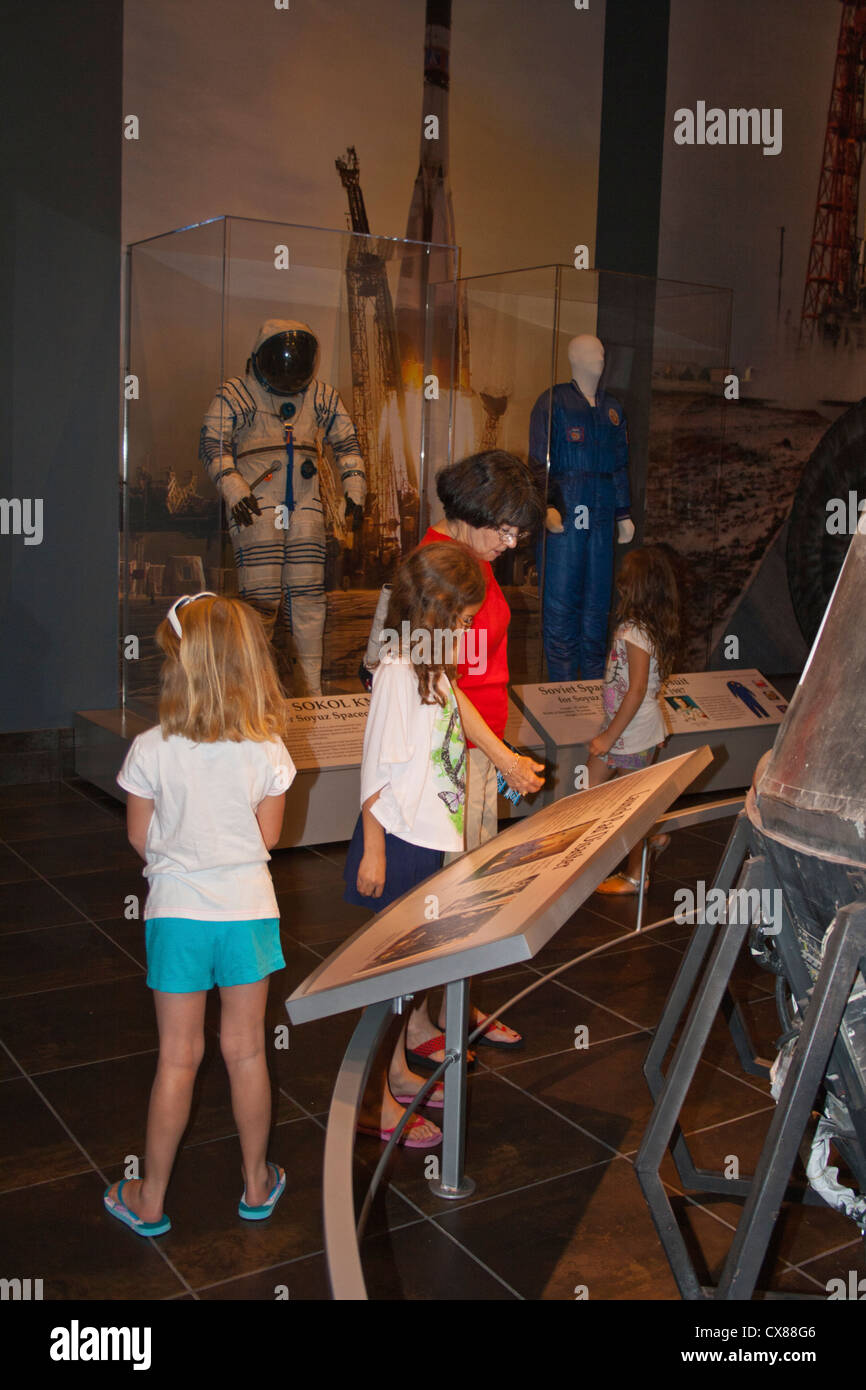 adult and children explore exhibit at Tellus Science Museum