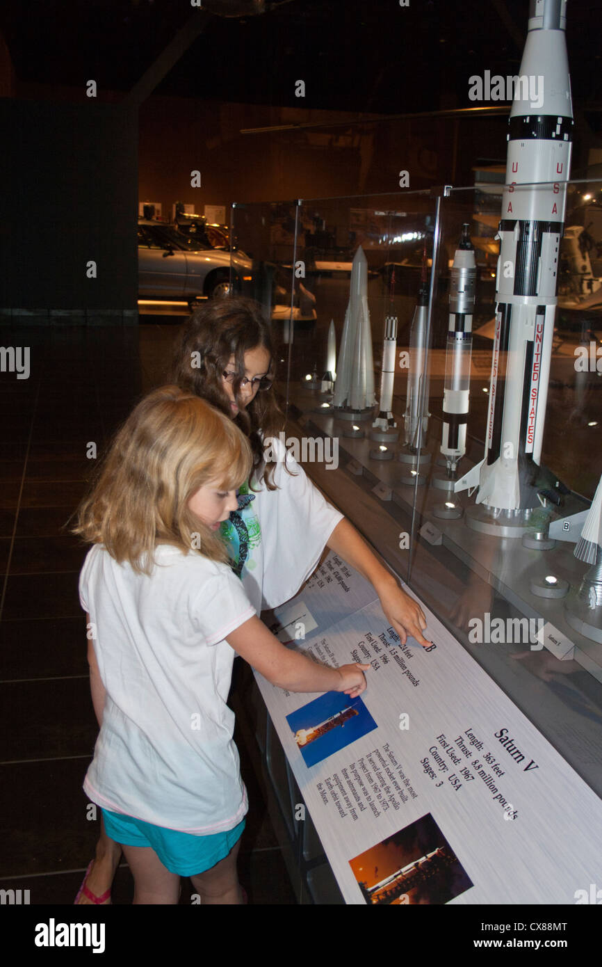 Young girls look at model rocket exhibit at Tellus Science Museum Cartersville Georgia USA Stock Photo