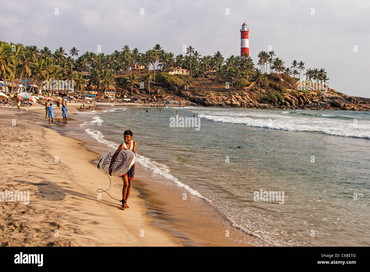 Kovallam beach, Surfer, lighthouse, India Kerala Stock Photo
