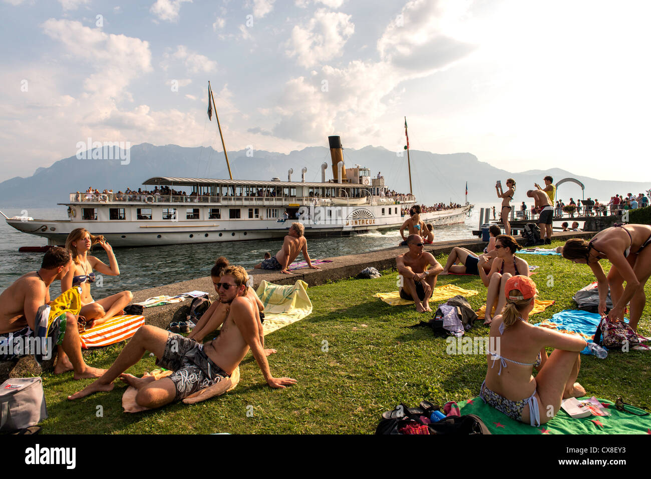 People relaxing by the Lausanne lake Switzerland Europe Stock Photo