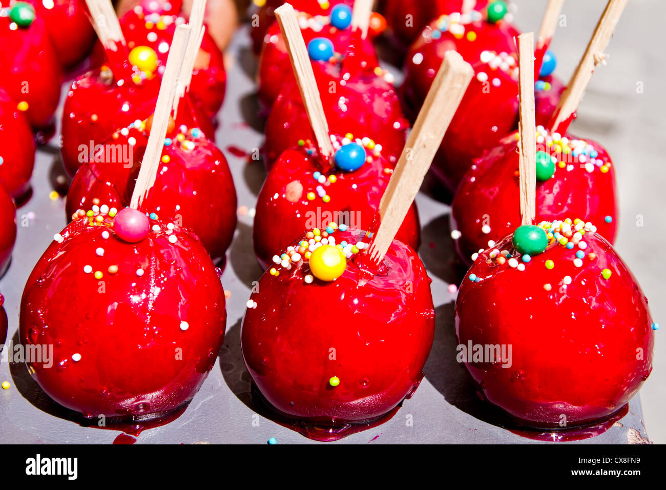 Colorful candy apples for sale at a market Stock Photo Alamy