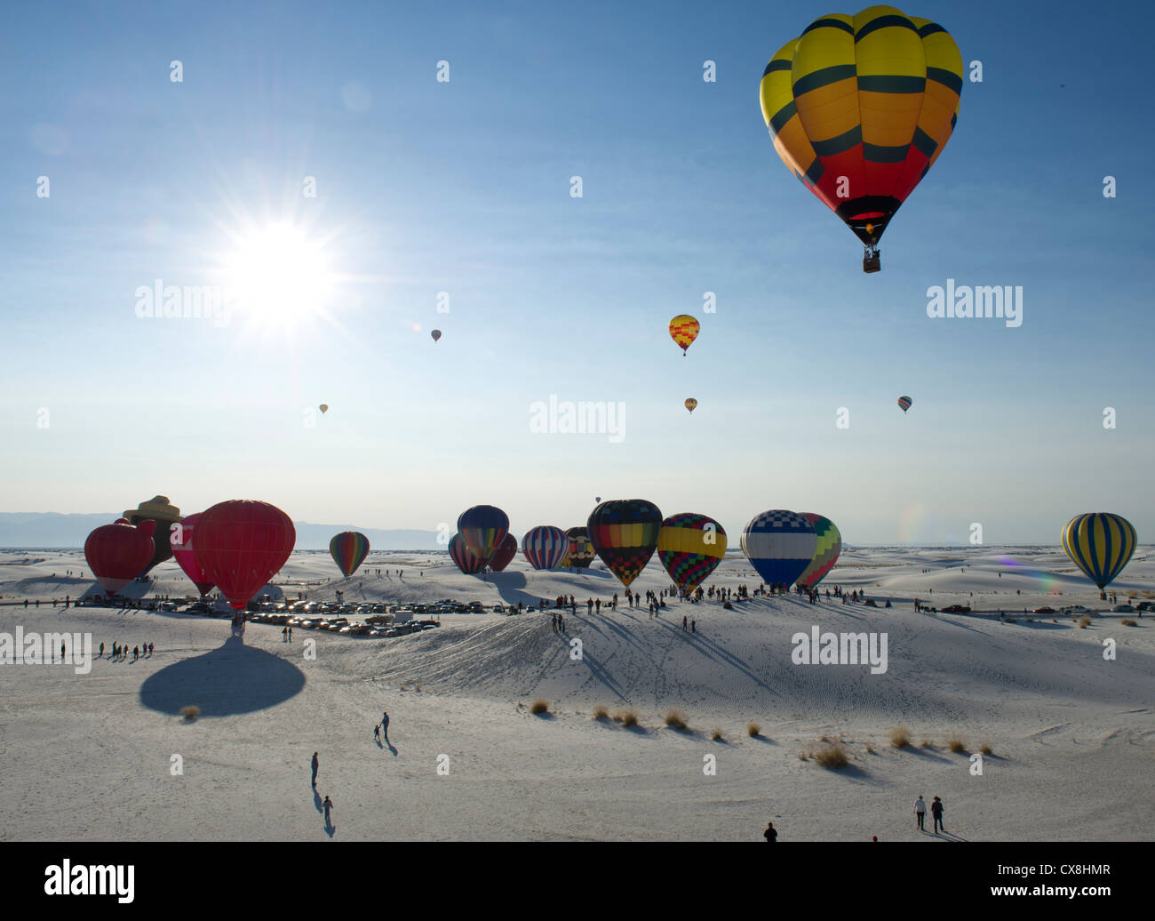 Hot air balloons fly above the White Sands National Monument, N.M., during the 21st annual White Sands Balloon Invitational Sept. 16. Balloonists came from Colorado, Arizona, Kansas, California, Texas and New Mexico for the two-day event, at which more than 50 balloons launched from both the balloon park in Alamogordo, N.M., and the White Sands National Monument. The event committee obtained a permit for balloons to fly over the monument, as normally private aircraft are not allowed in the airspace. Members of Team Holloman volunteered at the event. Stock Photo