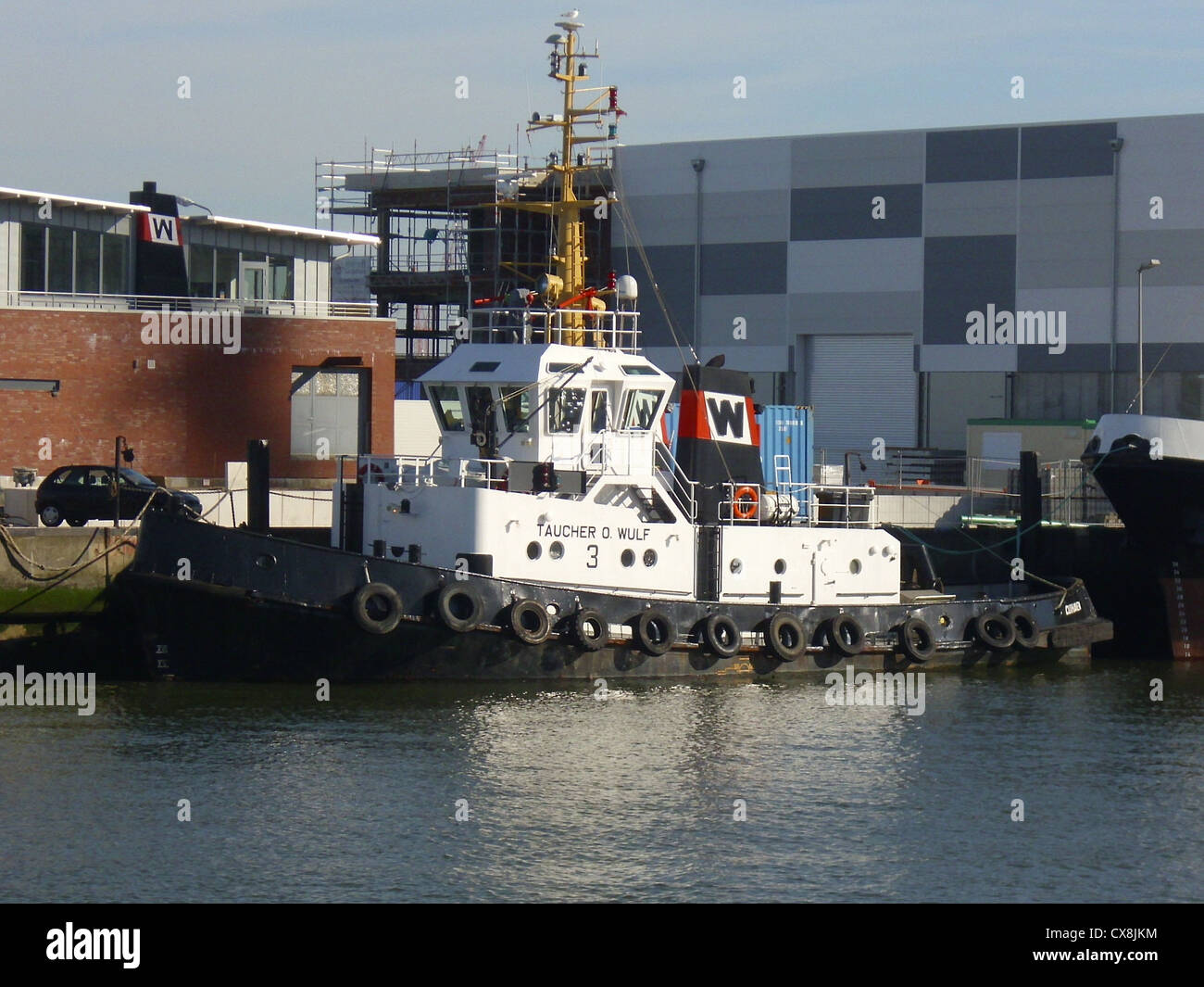 The tugboat '''Taucher O. Wulf 3''' in the port of Cuxhaven, Germany Stock Photo