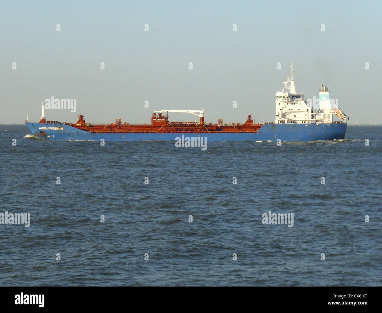 The oil/chemical tanker '''Maersk Nordenham''' outbound on the Elbe river Stock Photo