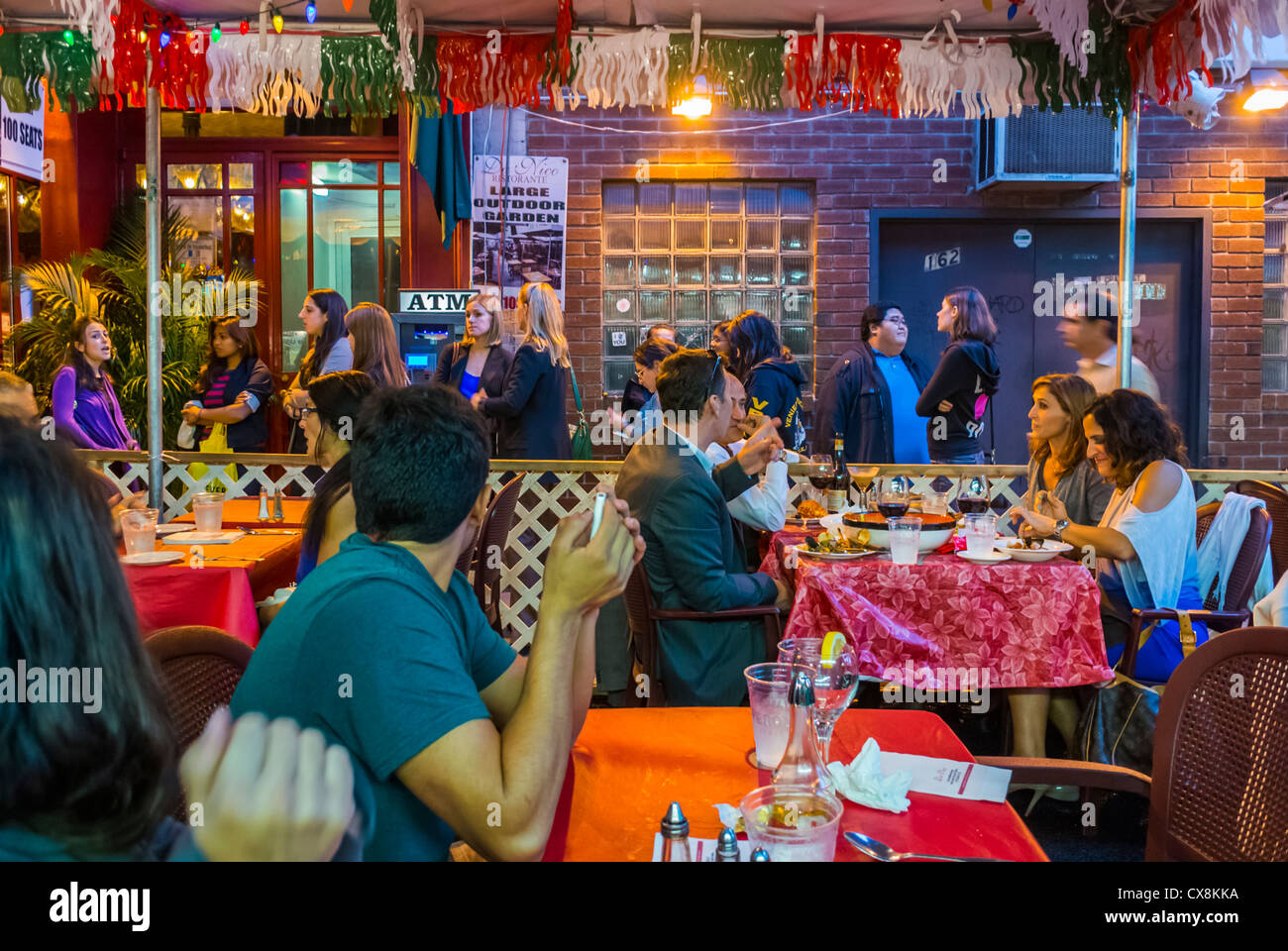 New York, NY, USA, Little Italy Area, 'San Gennaro' Italian Food Street Festival, American People SHaring Meals on Restaurant terrace, on Mulberry Street. Stock Photo
