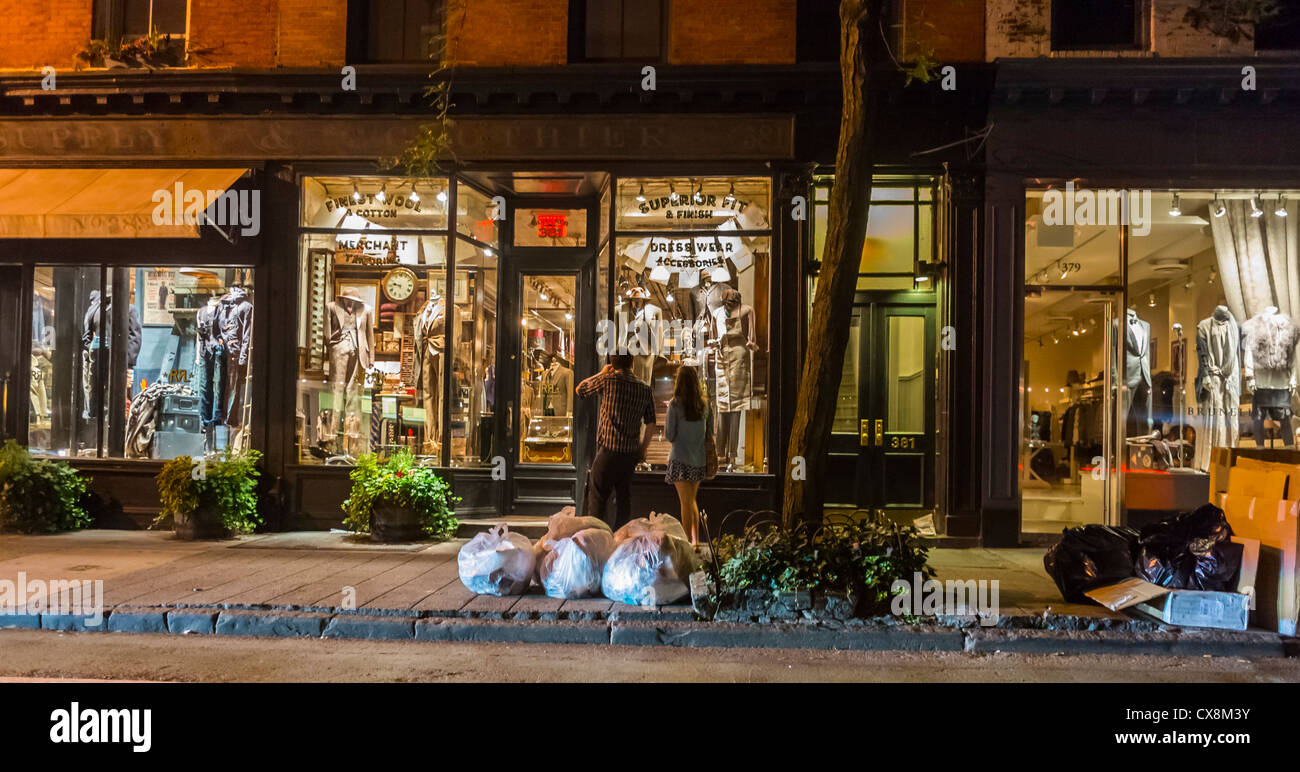 New York City, NY, USA, Couple, Shop Front Windows at Night, 'Ralph Lauren' Shopping in Greenwich Village, Bleecker Street, fashion mannequins, row of shops, lights Stock Photo
