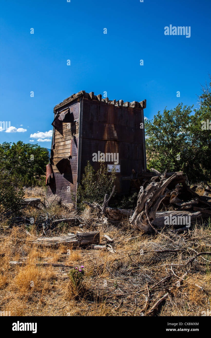A dilapidated house and water tower at an old homestead in Reno Nevada
