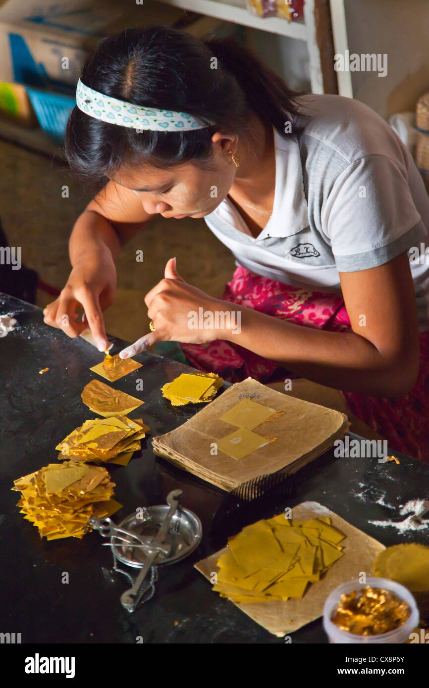 The making of GOLD LEAF is a specialty of MANDALAY - MYANMAR Stock Photo