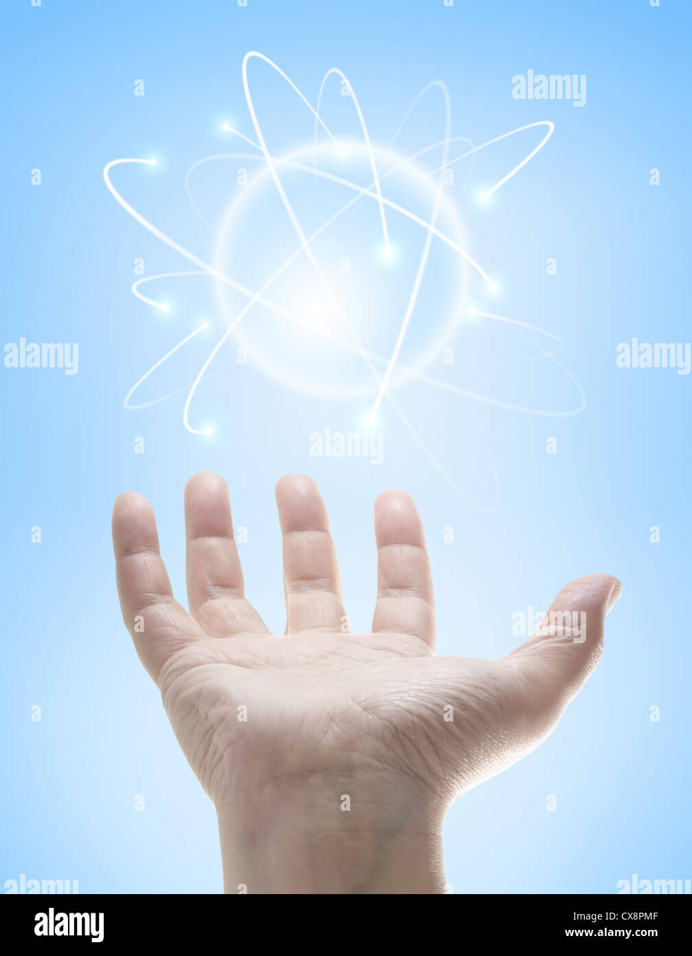 Power in the hands controlling a ball of energy. Stock Photo