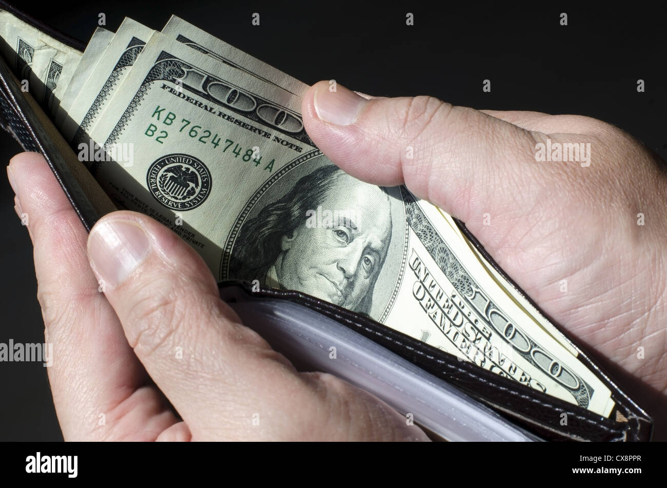 Wallet full of money, concept of wealth. Stock Photo