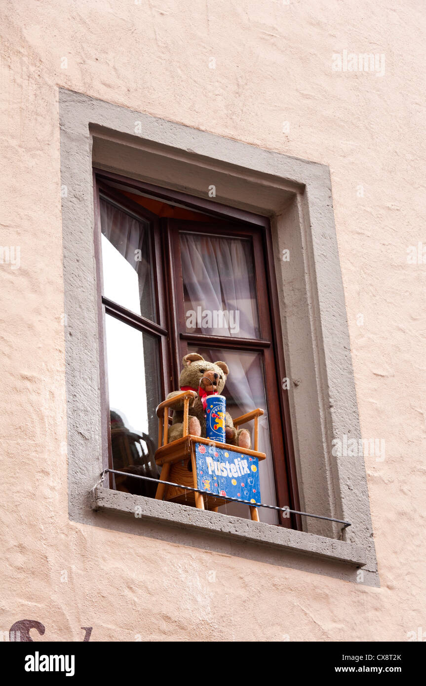 Teddy bear sitting on the window Stock Photo - Alamy