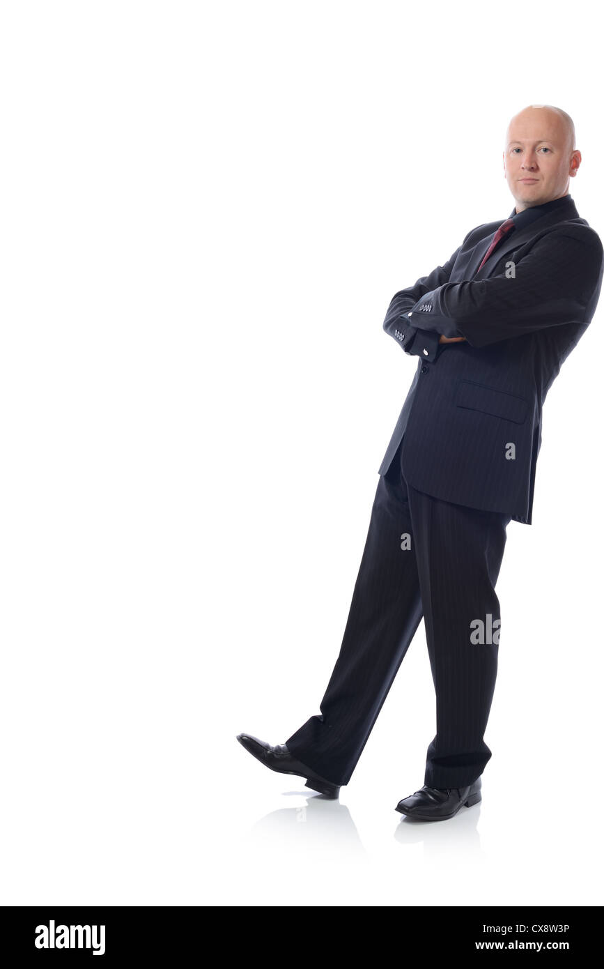 Man in suit leaning against something isolated on white Stock Photo