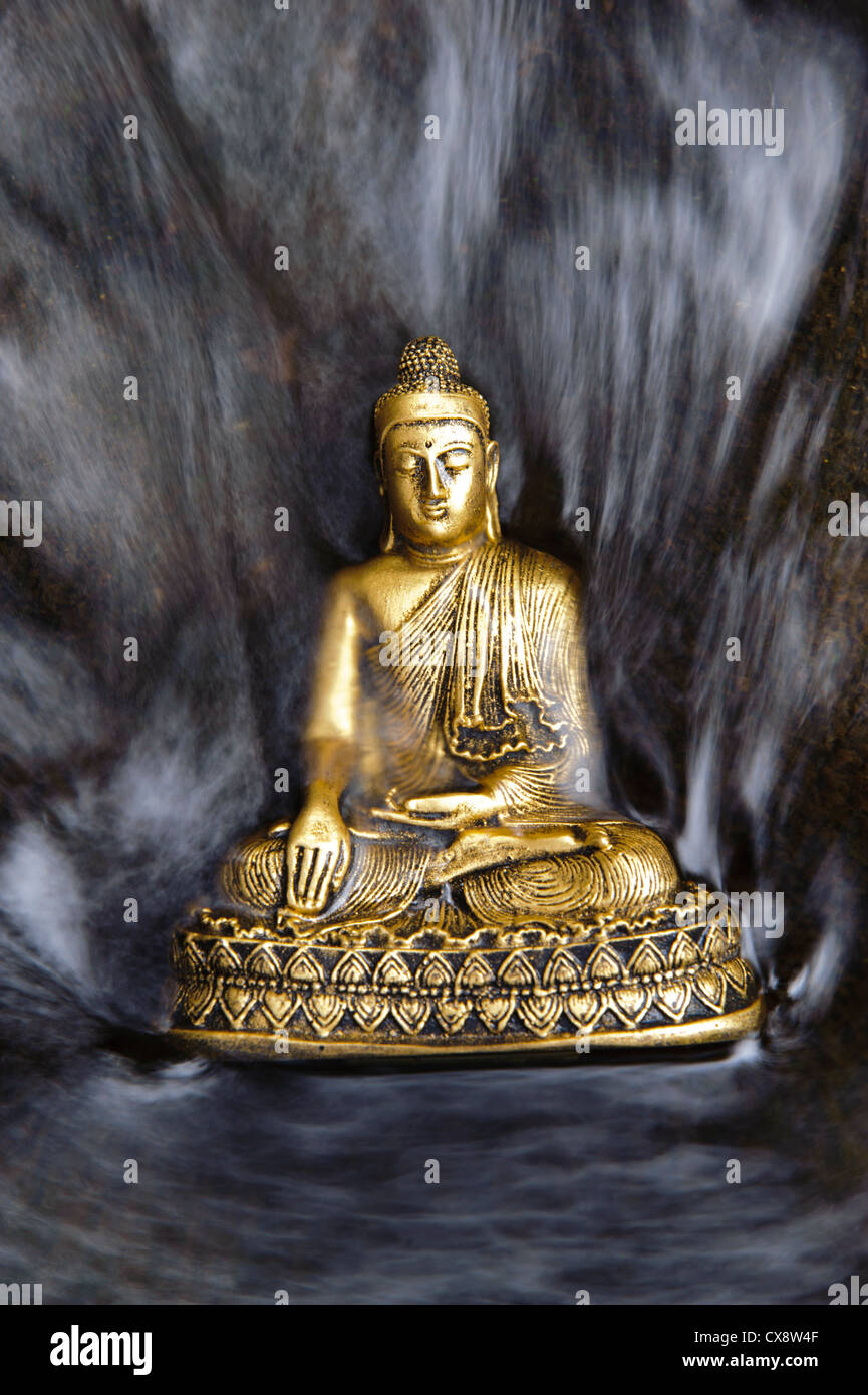 Buddha sculpture in flowing water Stock Photo - Alamy