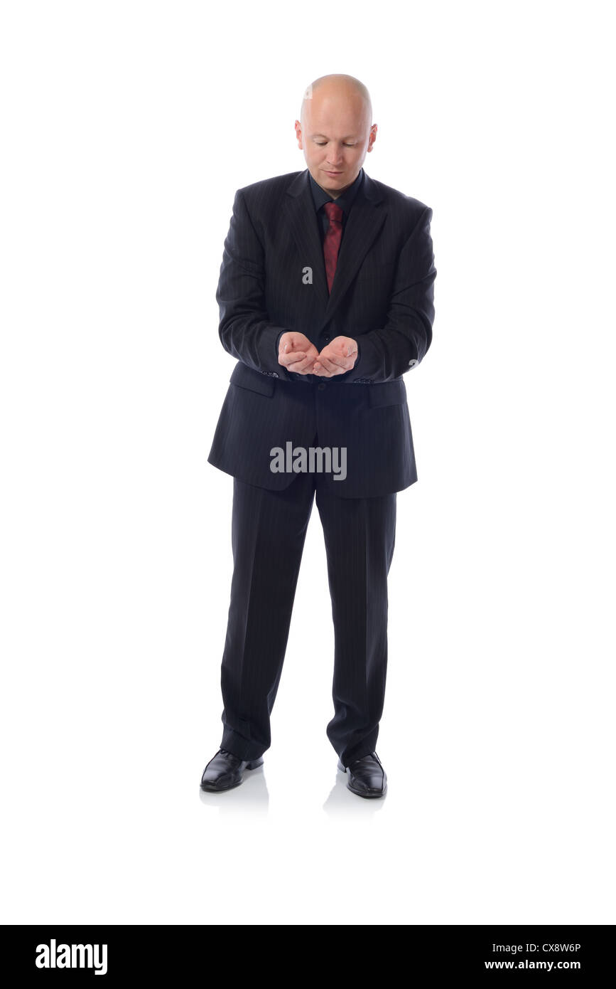 Business man in suit in a holding pose Stock Photo