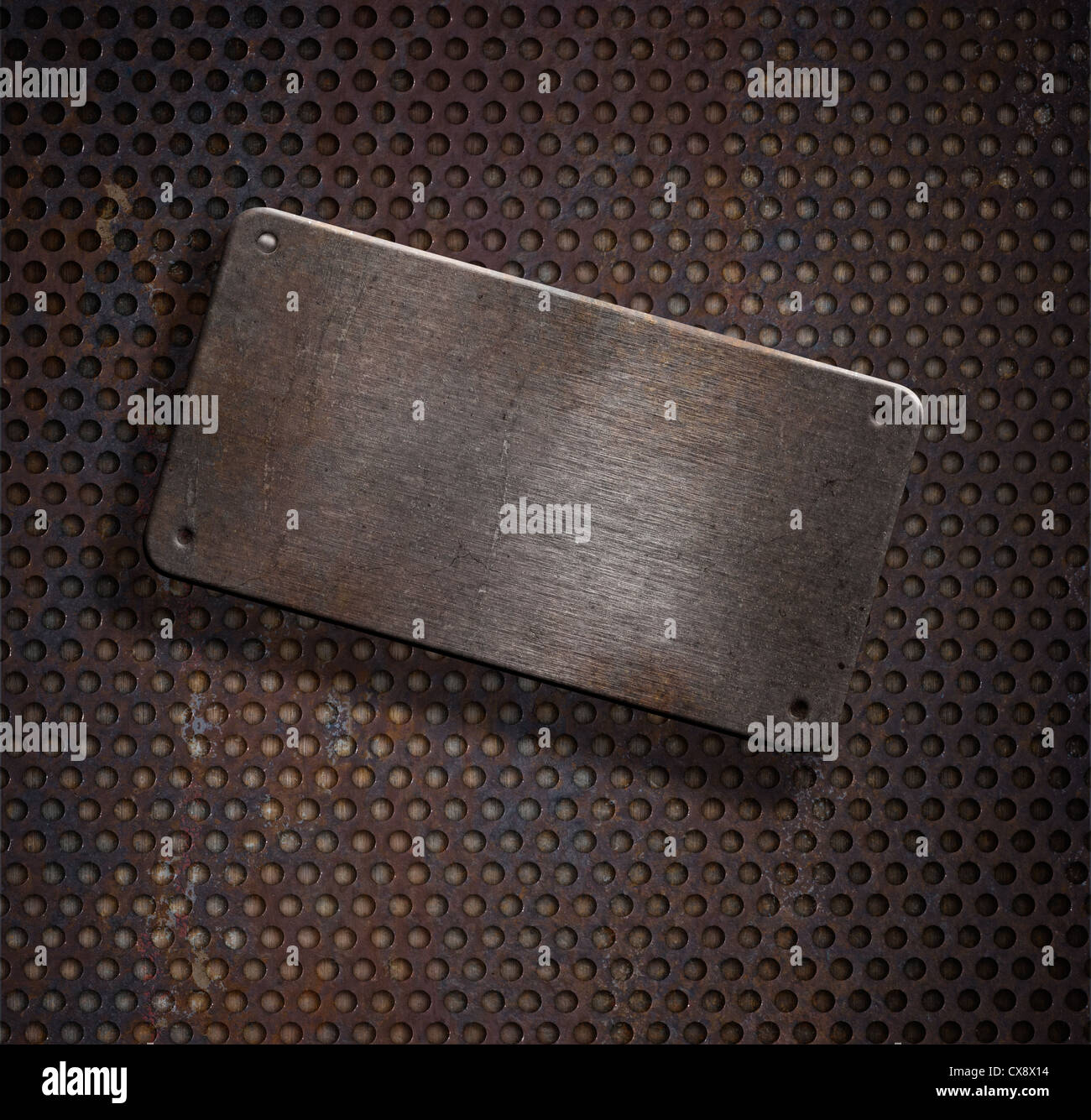 grunge rusty metal plate over grid background Stock Photo