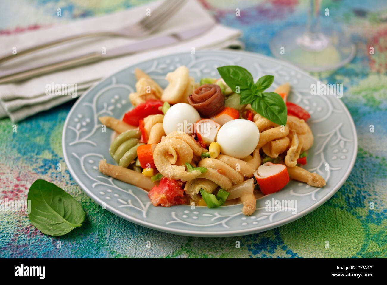 Pasta salad with surimi and eggs of quail. Recipe available. Stock Photo