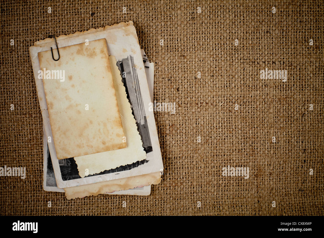 old photos bunch over burlap texture as a template for your picture Stock Photo