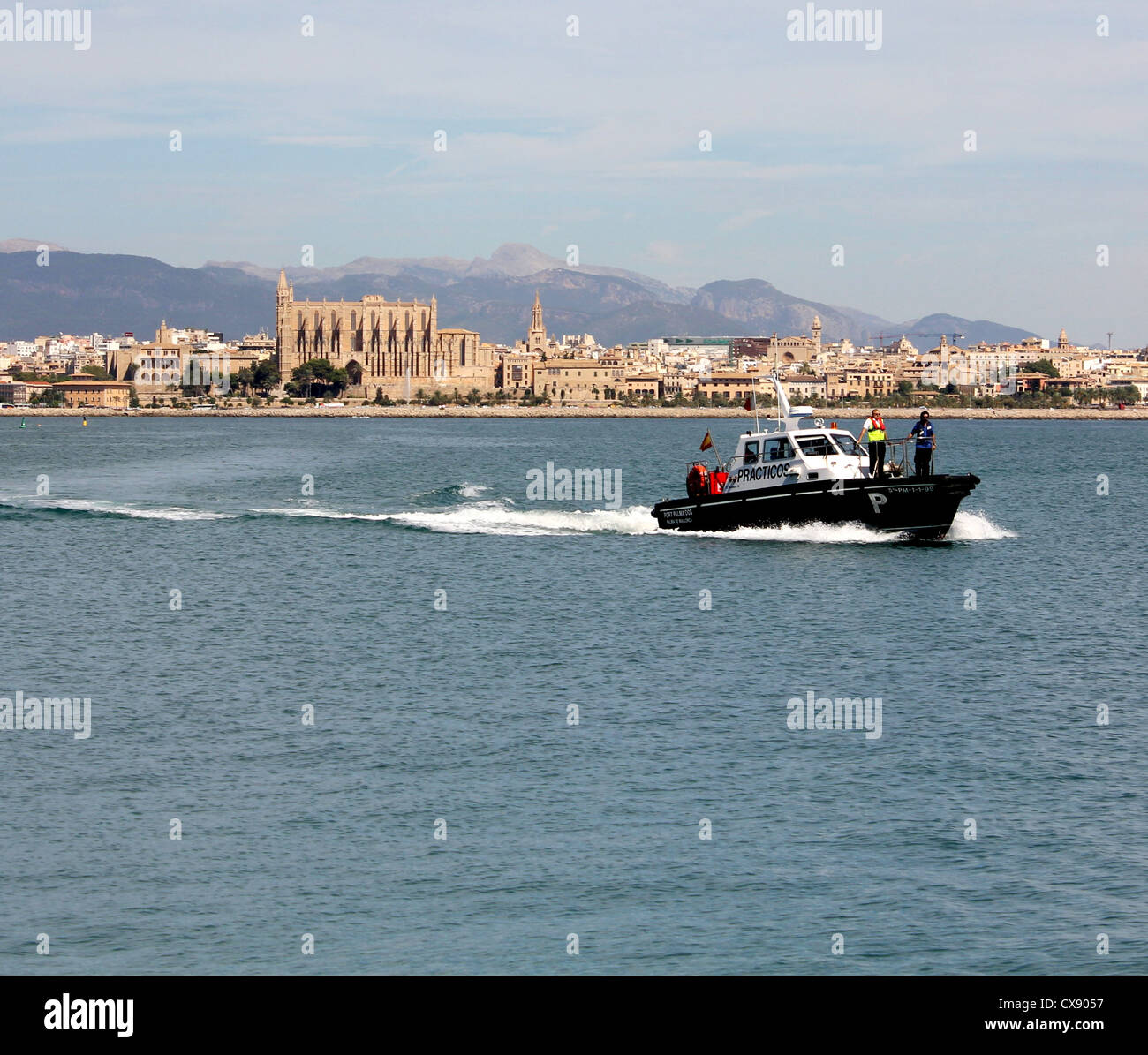 Practicos / Port Pilot launch with historic Palma Cathedral behind in the Port of Palma de Mallorca / Majorca, Balearic Isl;ands Stock Photo