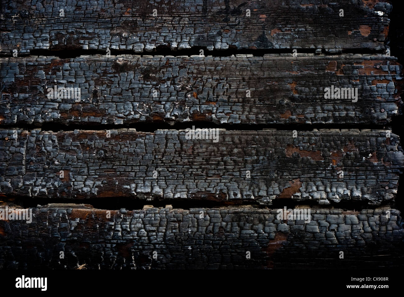 Closeup burned wooden wall after fire Stock Photo