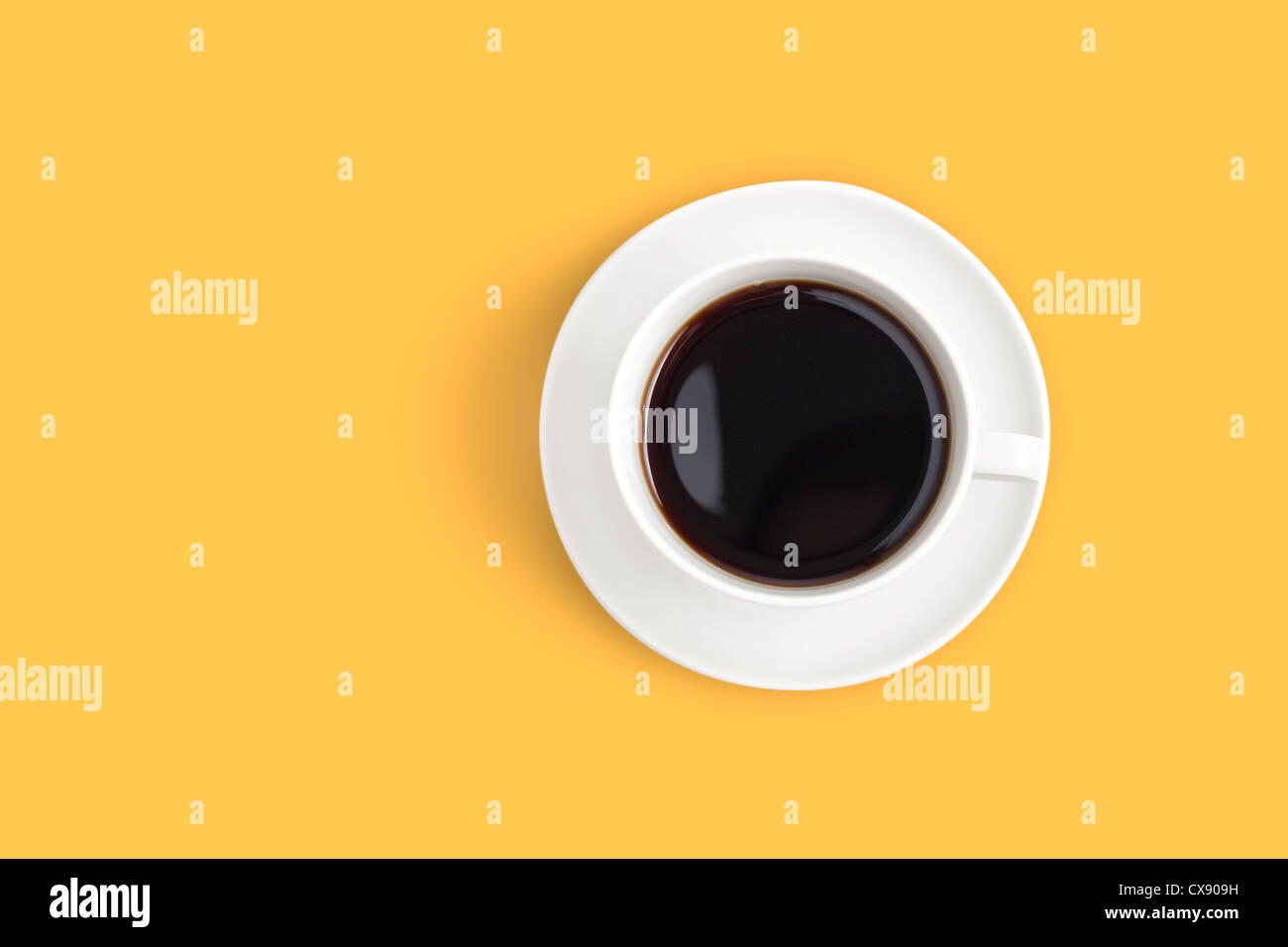 Top view of black coffee cup on yellow background Stock Photo