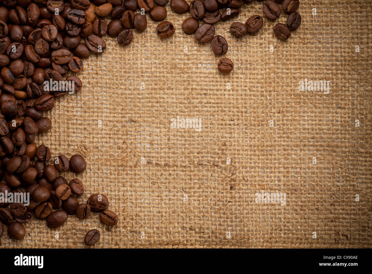 coffee beans on burlap background Stock Photo