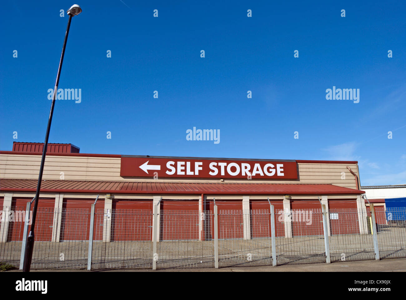 self storage facility with left pointing sign, hanworth, middlesex, england Stock Photo