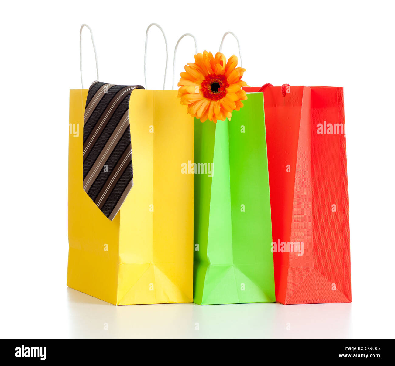 shopping bags with purchases for family on white background with reflection Stock Photo