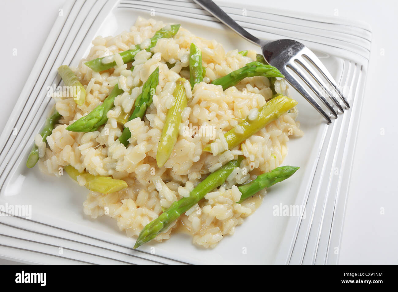A plate of homemade asparagus risotto made with arborio rice, onion