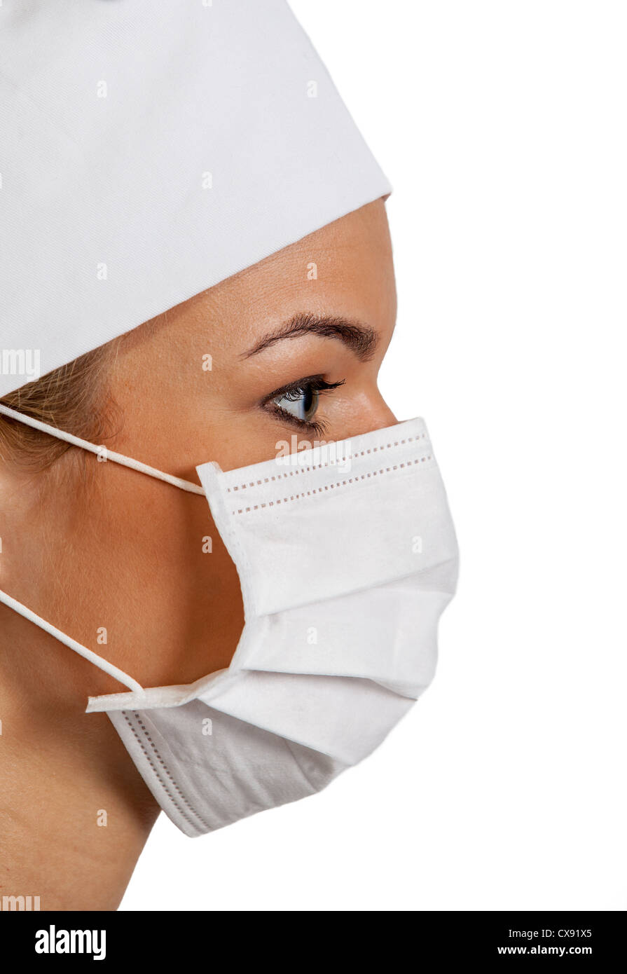 Profile of a young woman surgeon wearing a mask Stock Photo - Alamy