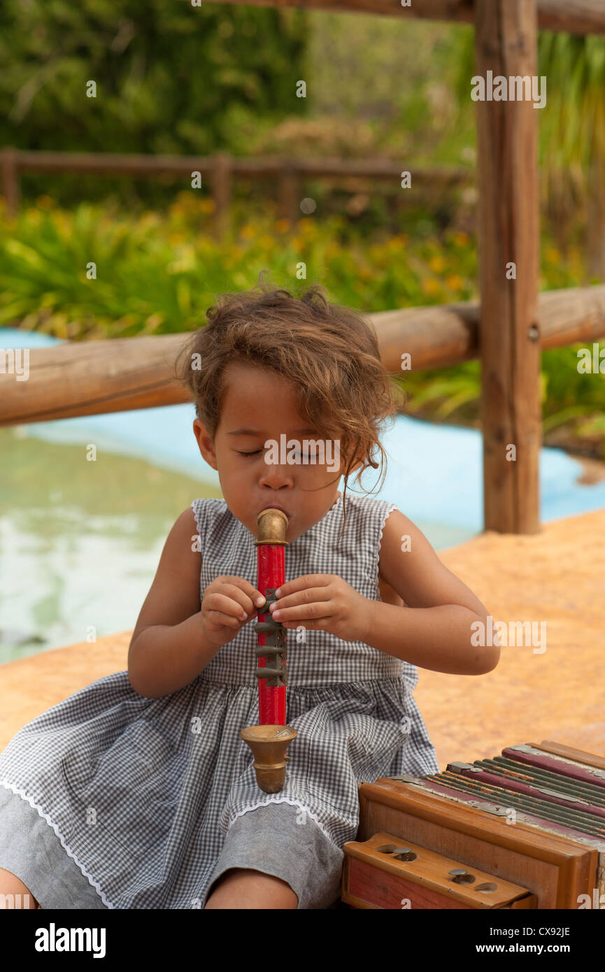 Cute girl in a park playing with vintage instruments Stock Photo - Alamy
