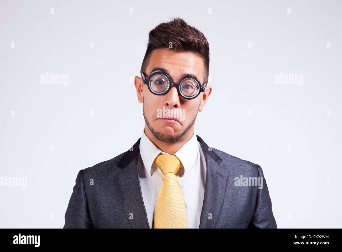 Sad nerd businessman with funny glasses Stock Photo