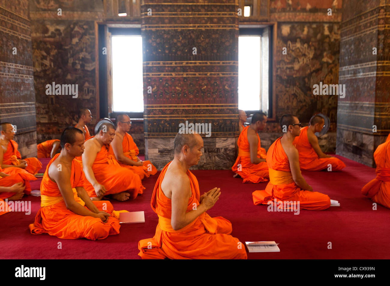 Monks praying in a temple in Chiang Mai Thailand Stock Photo