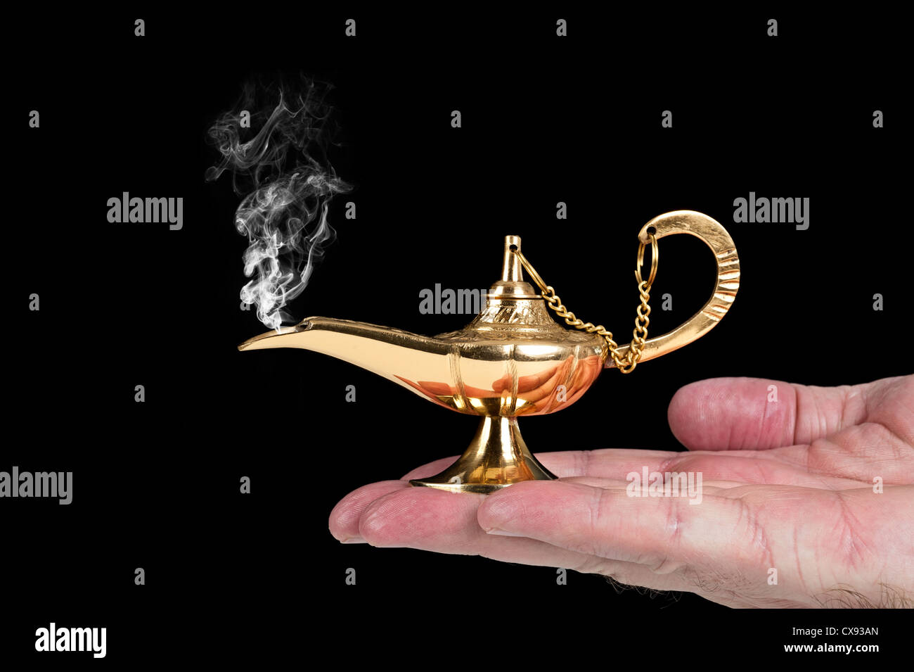 A man holds an active magic oil lamp with smoke rising out of it