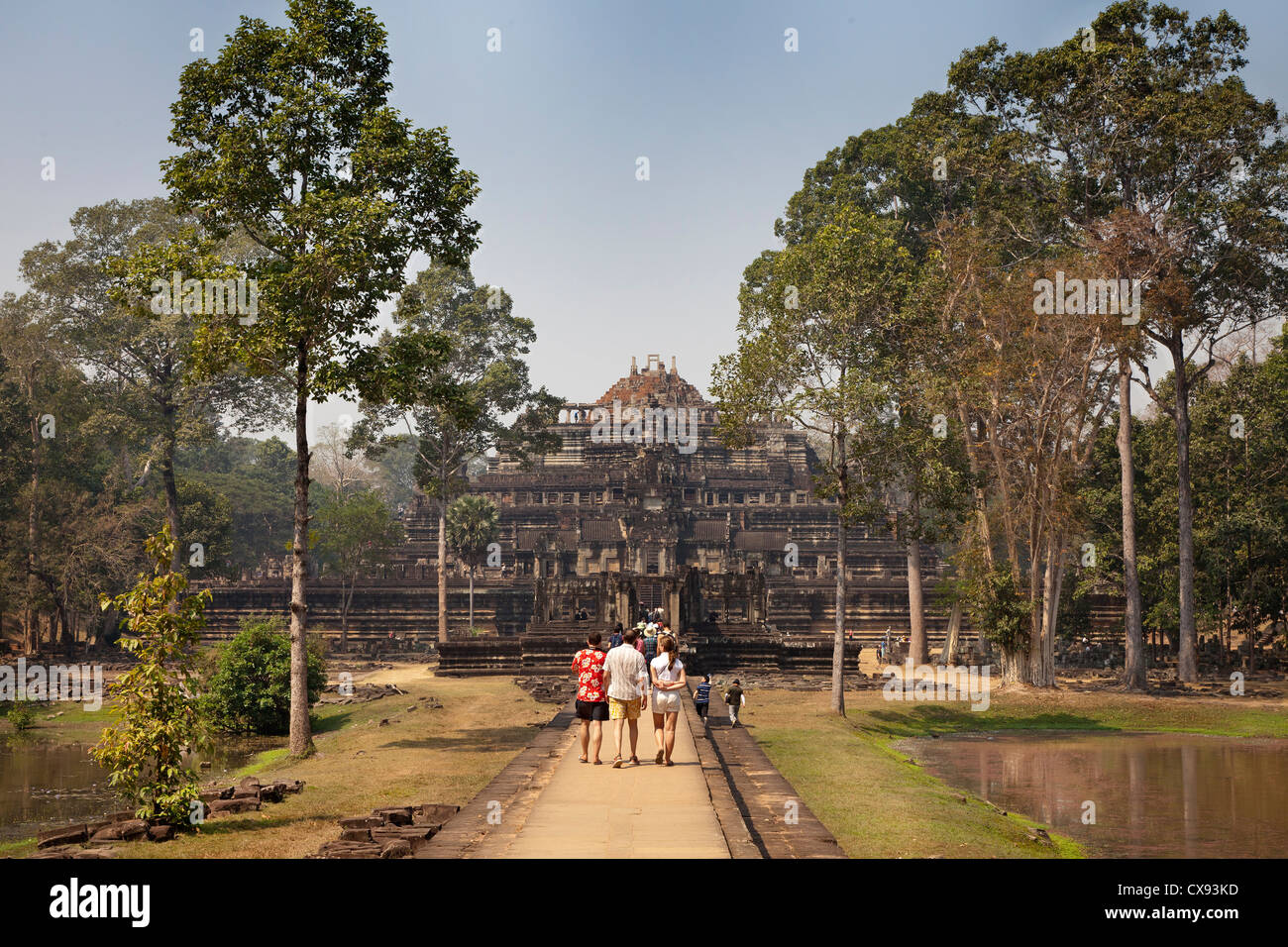 Angkor temple details, carvings, blocks, tourists visiting Stock Photo