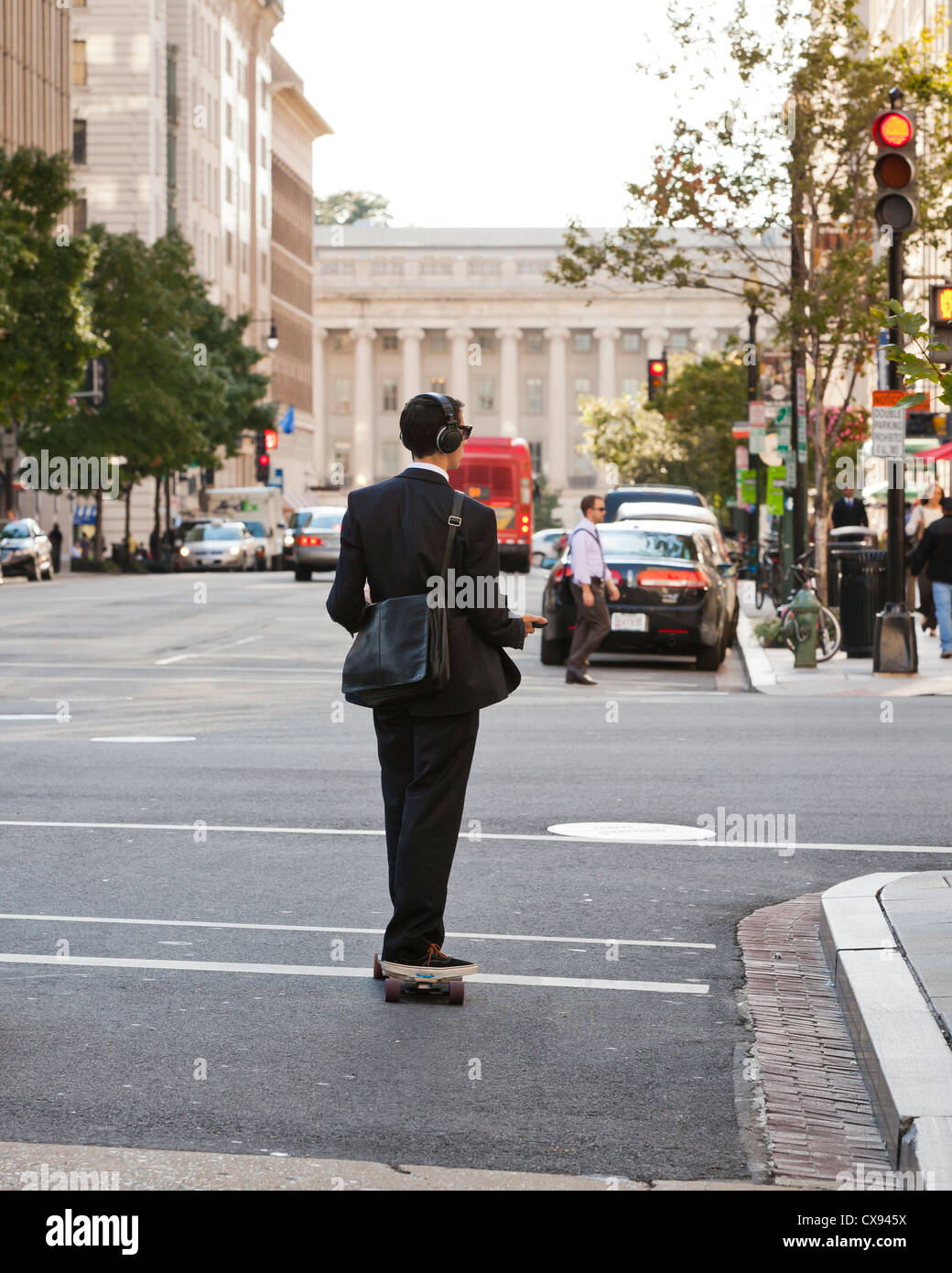 A young professional riding a skateboard in the city -  Washington DC USA Stock Photo