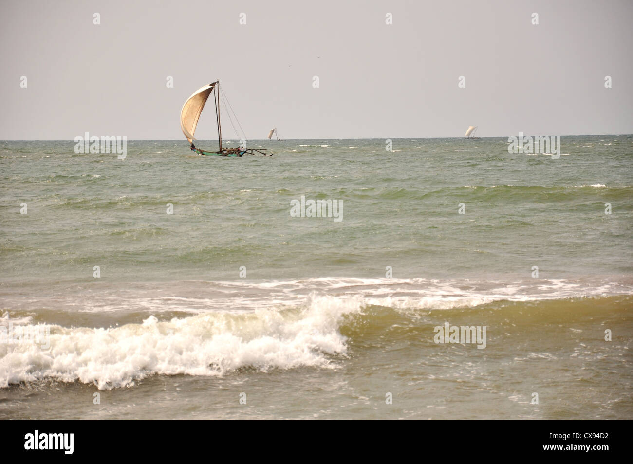 sailing boat in the rough sea at sri lanka Stock Photo