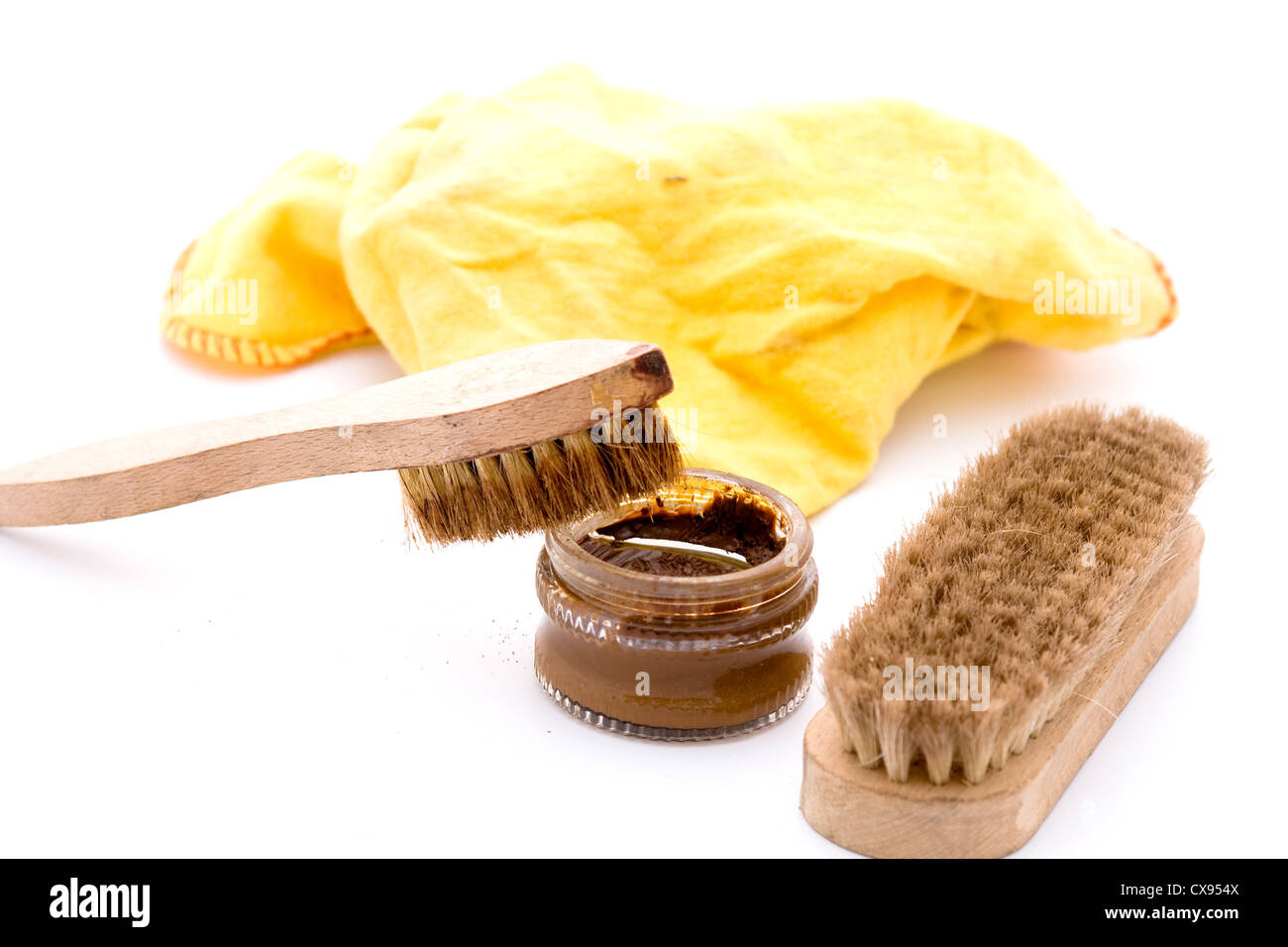 shoe polish with brushes in brown and yellow cloth Stock Photo Alamy