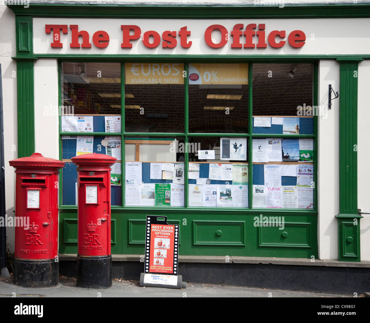 Post Office in Writtle Essex with two red post boxes outside Stock