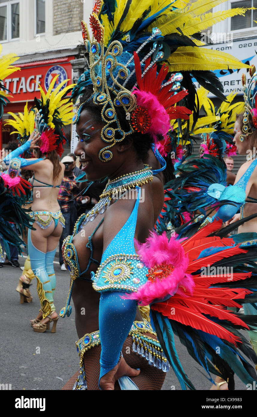 Woman in colourful dress at  Notting Hill Carnival on Monday 27th August 2012. Stock Photo
