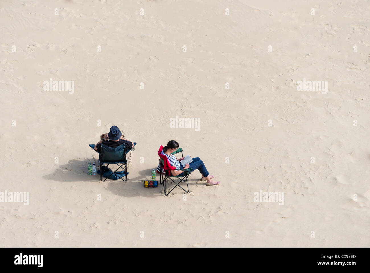 Couple relaxing on an English beach Stock Photo