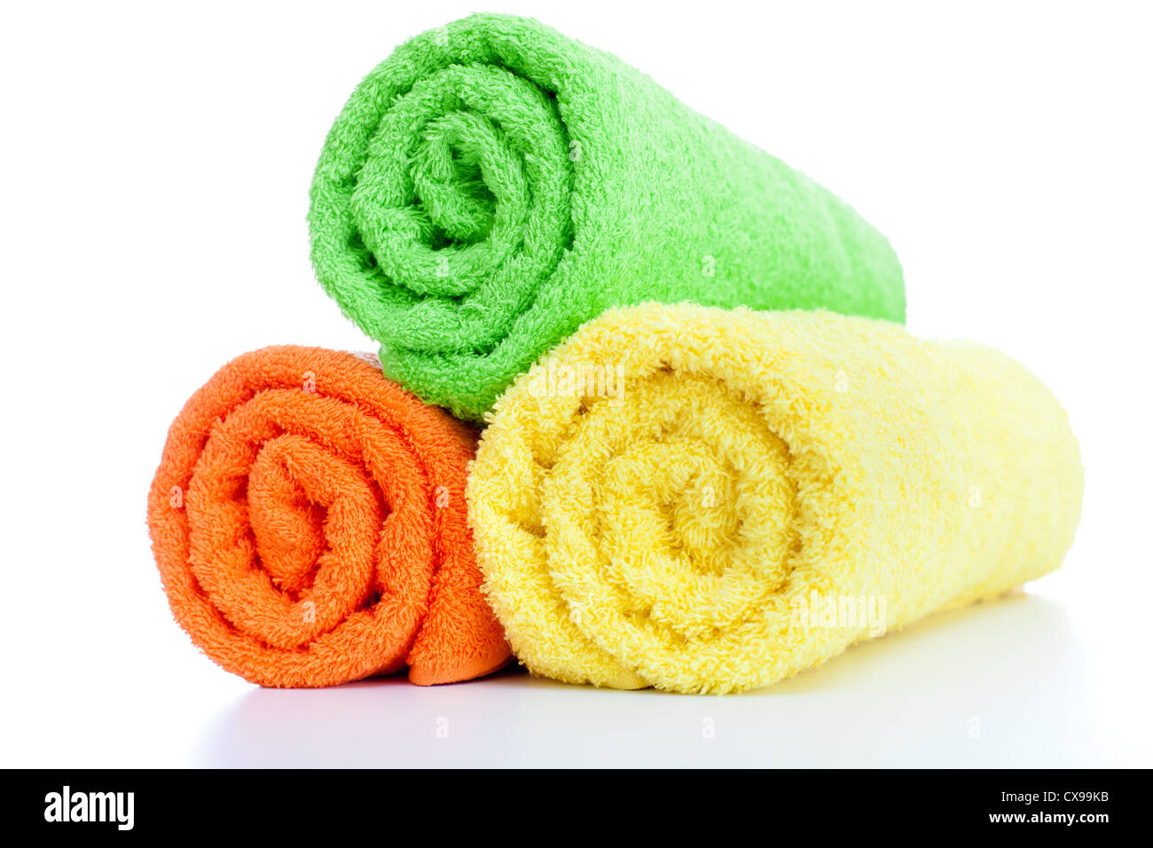 stack of fresh colorful towels rolls isolated Stock Photo