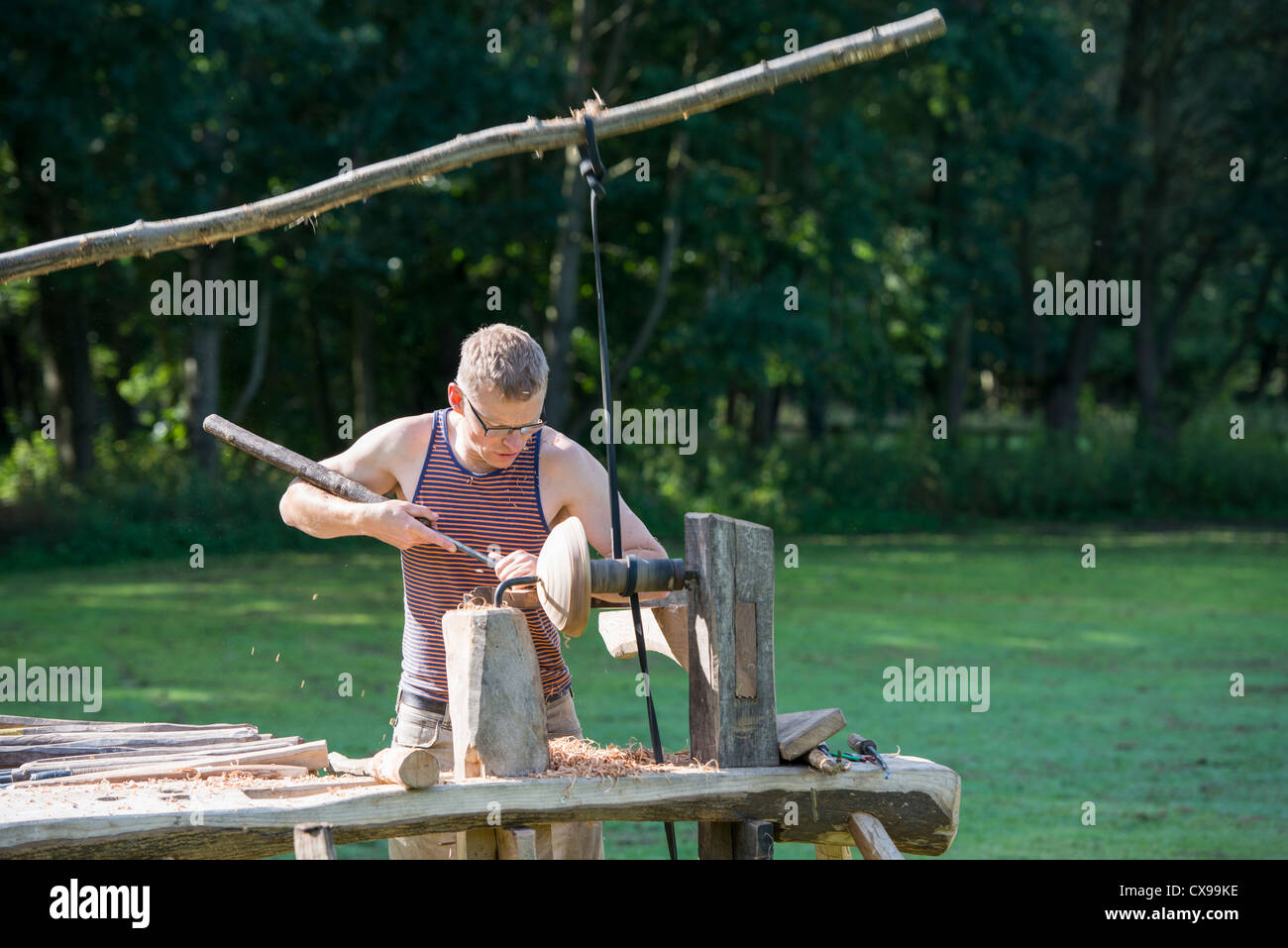 A Wood Turner Operating A Pole Lathe At Derbyshire Woodlands Festival A Wood Turner Operating A Pole Lathe At Derbyshire Woodlands Festival