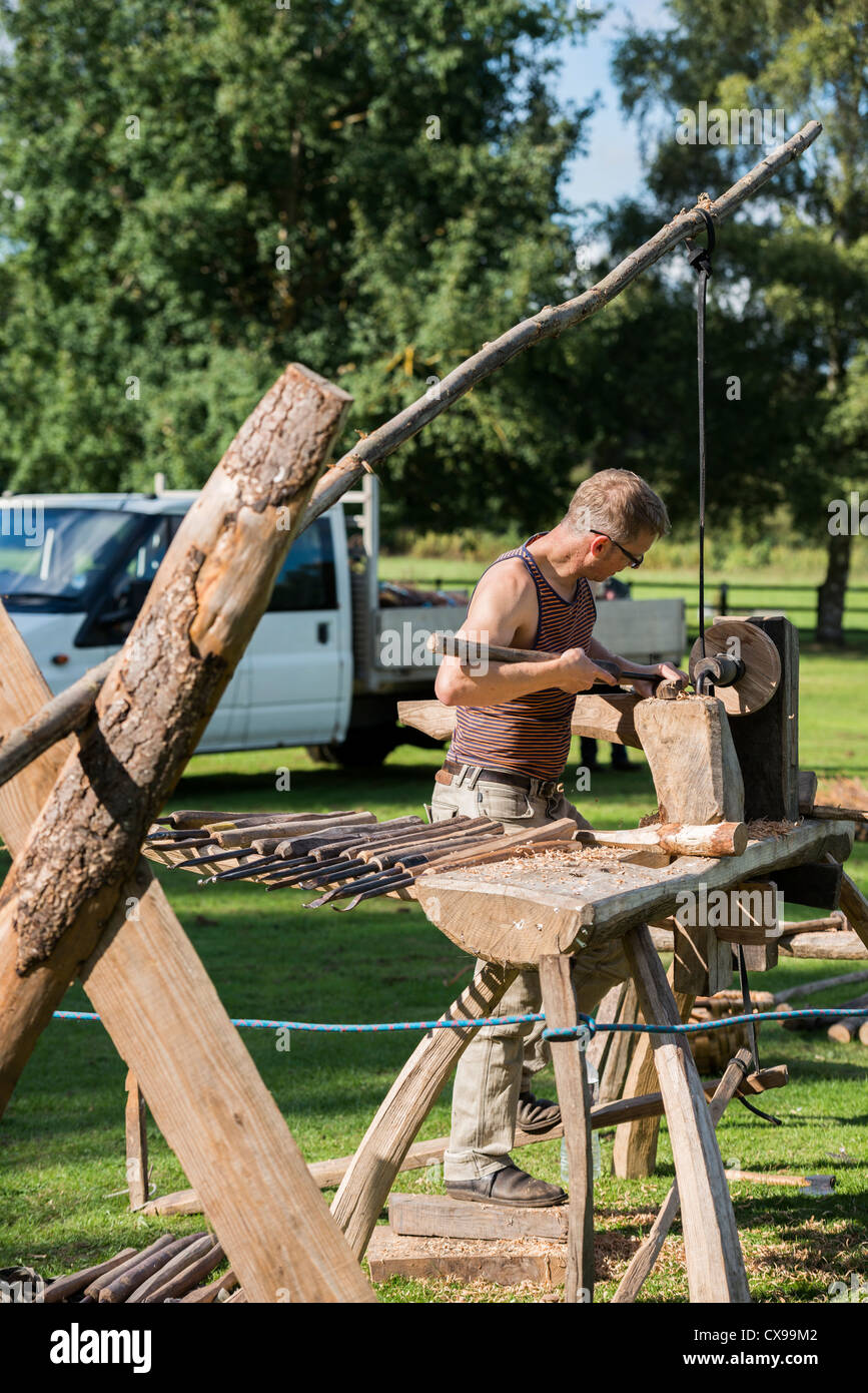 A Wood Turner Operating A Pole Lathe At Derbyshire Woodlands Festival A Wood Turner Operating A Pole Lathe At Derbyshire Woodlands Festival