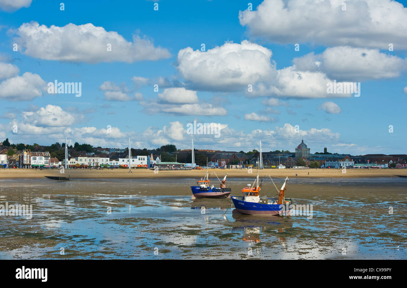 Two fishing boats anchored at low tide at Southend on Sea. Stock Photo