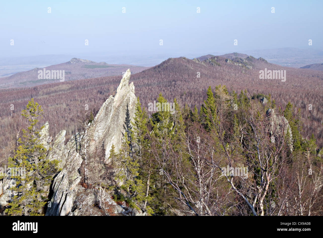 Rocky outliers in taiga forest.The ridge Alabiya. Southern Ural mountains. Bashkortostan. Russia. Stock Photo