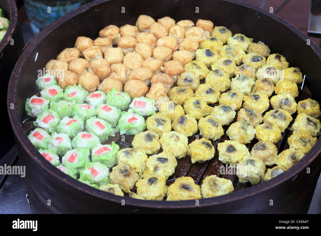 Chinese Dim Sum Cooking In Pan At Stall On Jonker Street Market In Chinatown Melaka Stock Photo Alamy