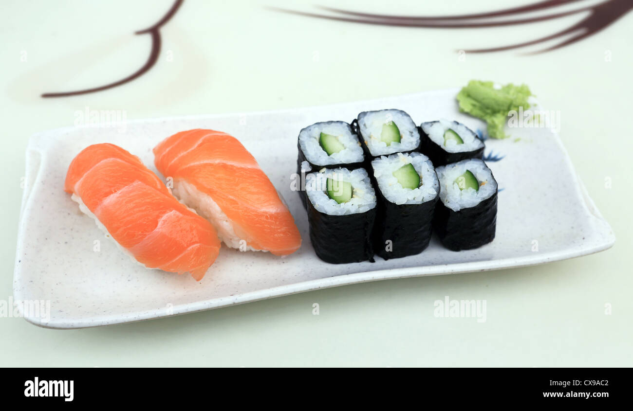Plate of salmon sashimi and vegetarian sushi with wasabi Stock Photo