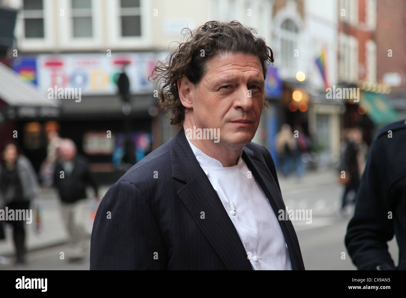 Celebrity Chef and Restauranteur Marco Pierre White takes a break from filming in Soho London. Stock Photo